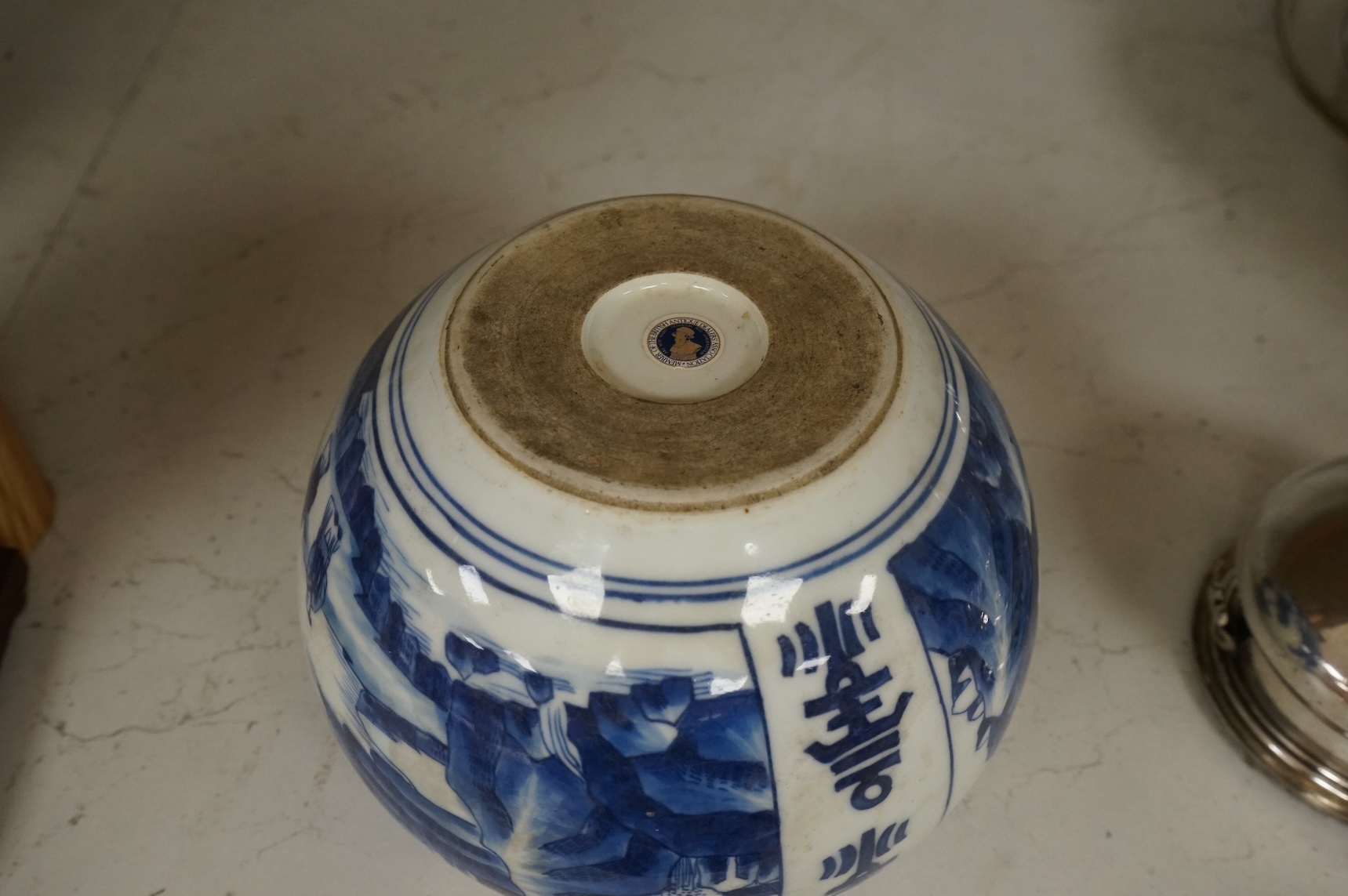 A Chinese blue and white water pot, decorated with two scenes in landscapes, 10.5cm high